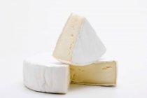 Partly sliced Camembert cheese — Stock Photo