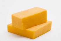 Pieces of Cheddar cheese — Stock Photo