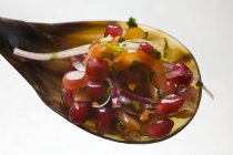 Pomegranate and onion salsa on white background — Stock Photo