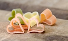 Colourful heart-shaped pasta — Stock Photo