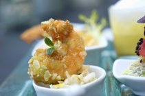 Closeup view of deep-fried prawn with coconut and herb — Stock Photo
