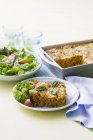 Baked risotto with salad — Stock Photo