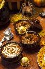 Halloween Soups with Halloween Decorations — Stock Photo