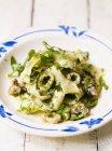 Ribbon tagliatelle pasta with herbs — Stock Photo