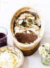 Closeup view of liver pate with apple horseradish and Cumberland sauce — Stock Photo