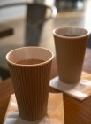 Paper cups of hot coffee — Stock Photo