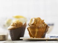 Banana muffins wrapped in baking papers — Stock Photo