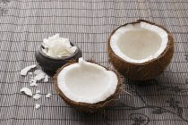 Fresh broken-open coconut — Stock Photo