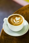 Latte with Flower Design in White Mug — Stock Photo