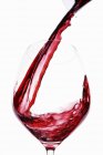 Red Wine being poured into glass — Stock Photo
