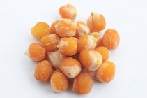 A pile of cooked chickpeas over white surface — Stock Photo