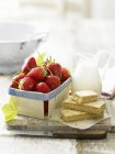 Fresh strawberries  on wooden desk — Stock Photo