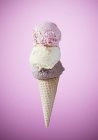 Cone with strawberry, vanilla and chocolate ice cream — Stock Photo