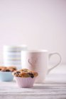 Muffins and cups of coffee — Stock Photo