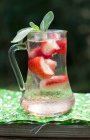 Closeup view of cold strawberry drink with fresh sage — Stock Photo