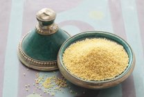 Millet grains in Oriental dish — Stock Photo