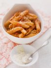 Penne arrabiata pasta with parmesan — Stock Photo