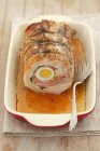 Rolled roasted pork filled with egg — Stock Photo