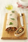 Closeup view of mushroom strudel with peppers — Stock Photo