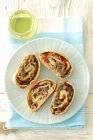 Top view of four slices of mushroom strudel with peppers — Stock Photo