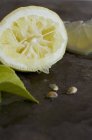 Squeezed lemon half — Stock Photo