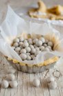An individual tart case filled with soya beans for blind baking — Stock Photo