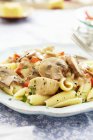 Chicken with pasta and mushrooms — Stock Photo