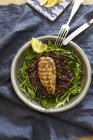 Top view of chicken breast on lentils with rocket — Stock Photo