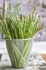 Asparagus in deep-frying basket — Stock Photo