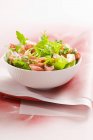 Closeup view of mixed leaf salad with pastrami — Stock Photo