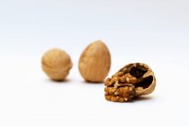Three walnuts over white background — Stock Photo