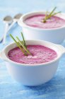 Beetroot soup with chives in bowls — Stock Photo