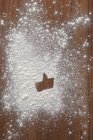 Closeup view of like symbol in flour on wooden surface — Stock Photo