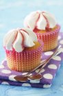 Cupcakes on spotted cloth — Stock Photo