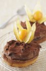 Biscuits topped with ganache and physalis — Stock Photo