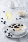Porridge with fresh blueberries — Stock Photo