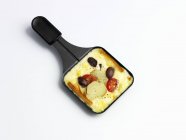 Raclette with potatoes and tomatoes — Stock Photo