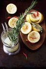 Squeezed Lemons with Rosemary — Stock Photo