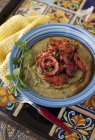 Eggplant Dip with Rosemary and Roasted Tomatoes in blue plate — Stock Photo