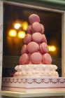 Pyramid of macaroons on cake — Stock Photo