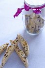 Closeup view of Biscotti and tied glass jar — Stock Photo