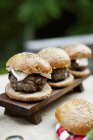 Grilled buffalo burgers in wholemeal buns — Stock Photo