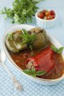 Stuffed Peppers in Tomato Basil Sauce in white dish — Stock Photo