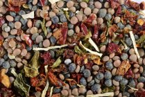 Closeup view of a mix of lentils, dried vegetables and herbs — Stock Photo