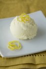 Scoop of lemon ice cream — Stock Photo