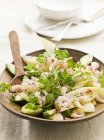 Chicory salad with grapefruit, prawns and avocado on wooden plate with spoon — Stock Photo