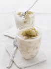 Closeup view of gooseberry fool in glasses with spoons — Stock Photo