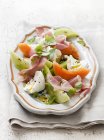Melon salad with ham and egg — Stock Photo