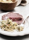 Sliced Roasted beef with parsnip — Stock Photo