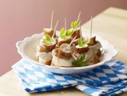 Pretzel and white sausage skewers — Stock Photo